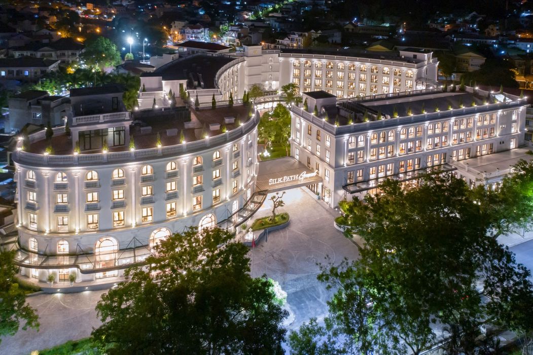 Hotel exterior at night — Silk Path Grand Hue
